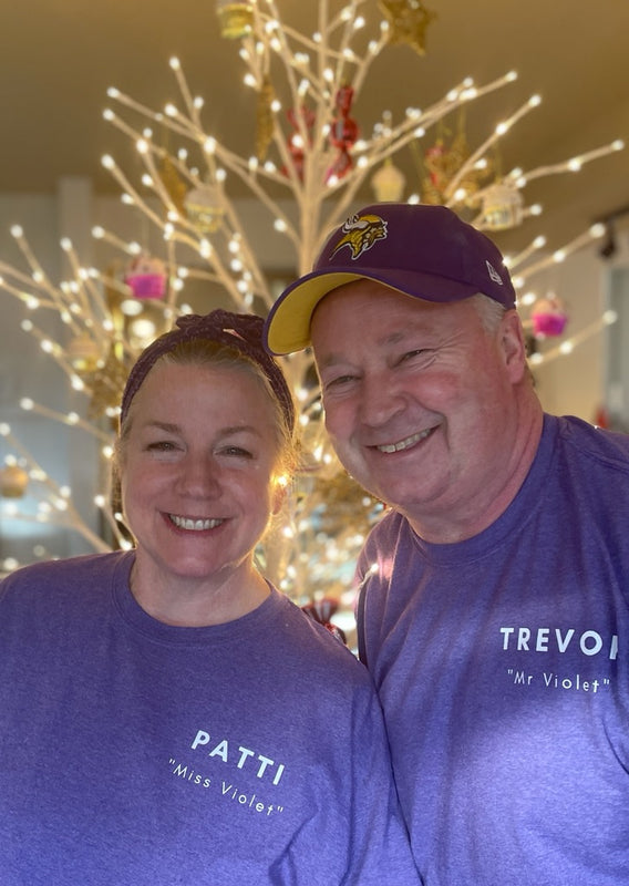 A smiling team behind Violets On Main