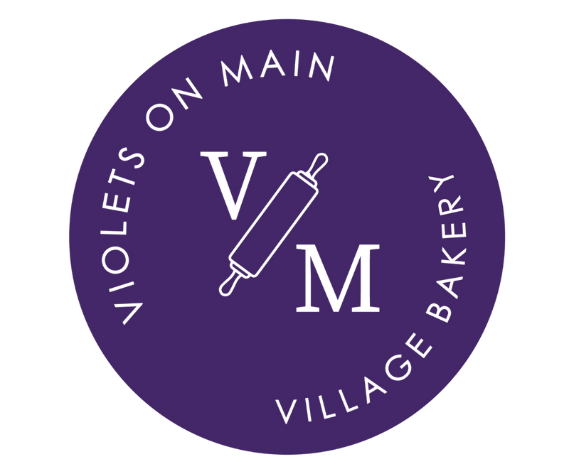 Violets On Main — Village Bakery logo